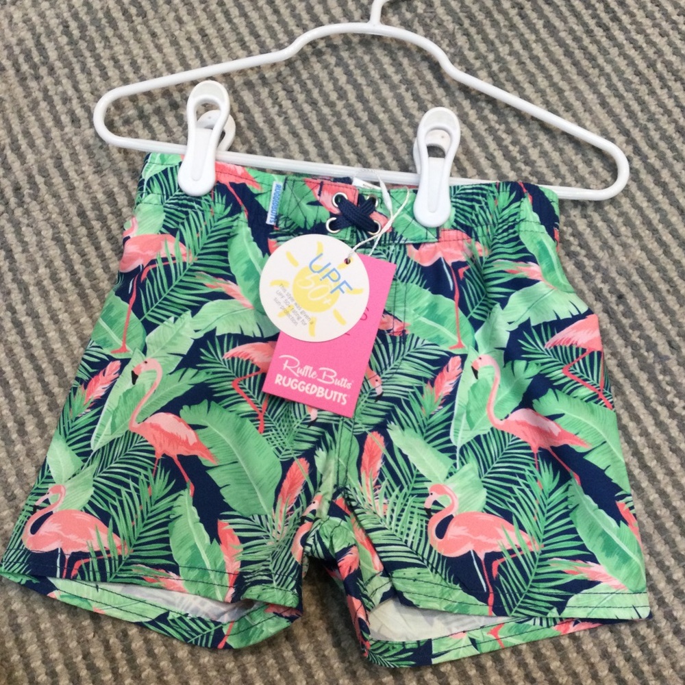 Ruffle Butts Rugged Butts Swim Trunks Flamingo